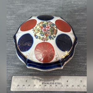 Antique white porcelain tinket box with lid hand painted gold leaf.Queen Ann leg